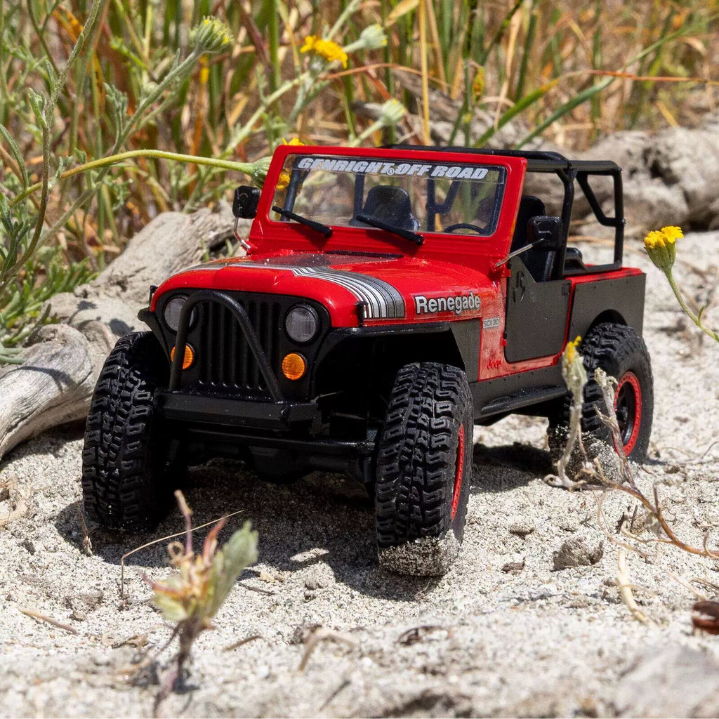 Red Axial SCX30 Jeep CJ-7 crawler on outdoor terrain