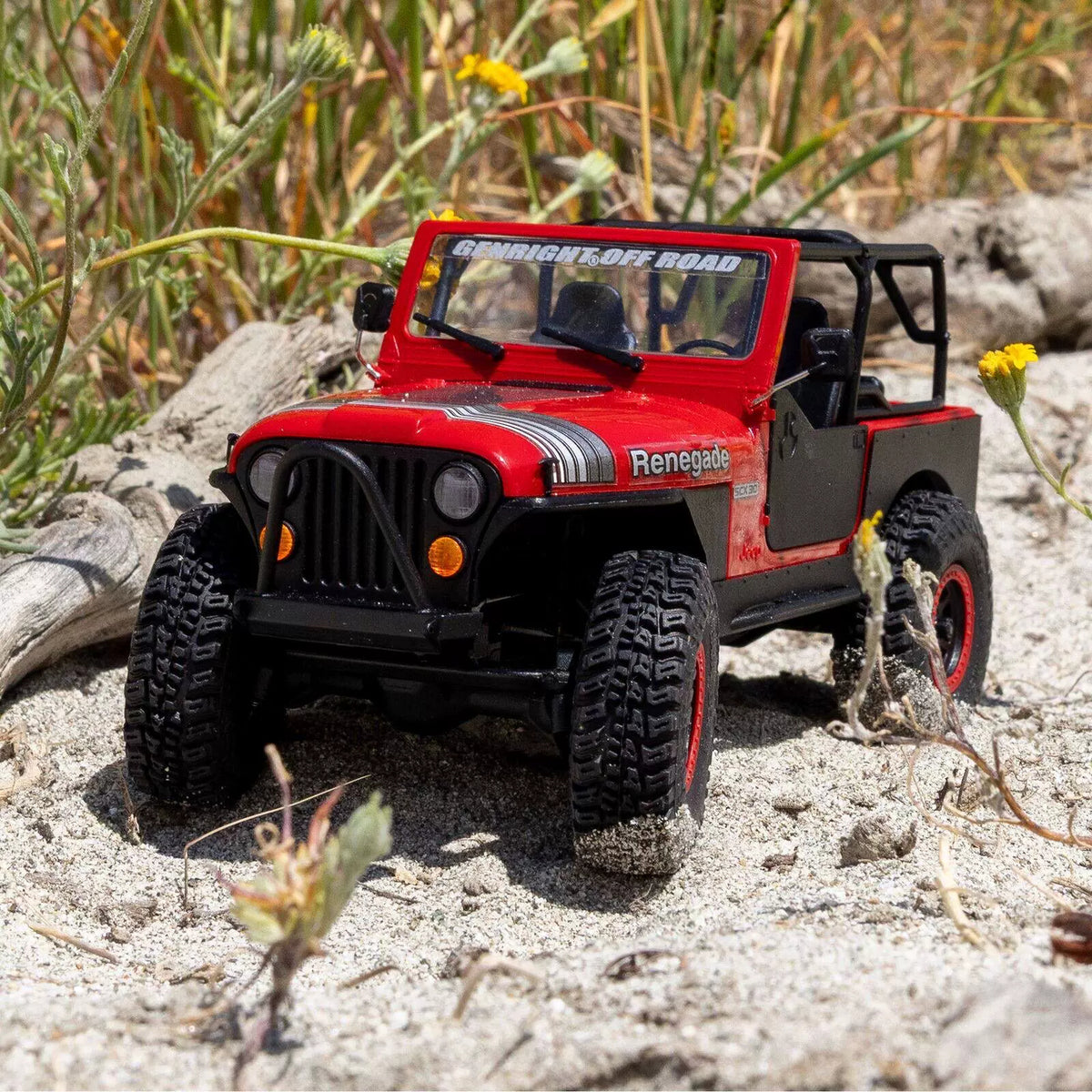 Red Axial SCX30 Jeep CJ-7 crawler on outdoor terrain