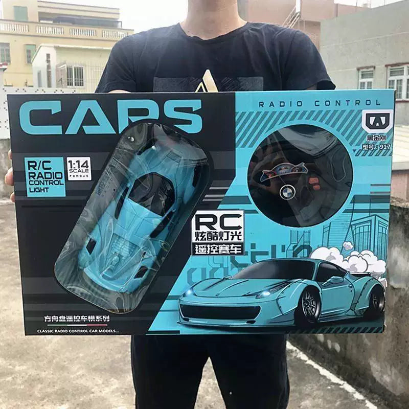 Blue rounded coupe and wheel-style controller in its exact retail kit.
