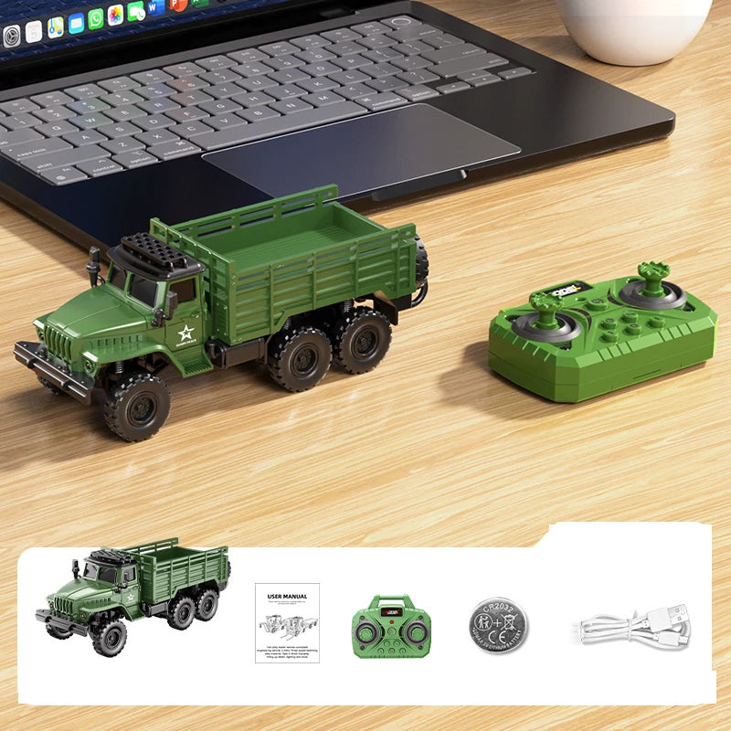 Green mini truck, matching handheld controller and listed accessories.