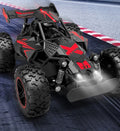 Red and black RC buggy viewed from above at a three-quarter angle
