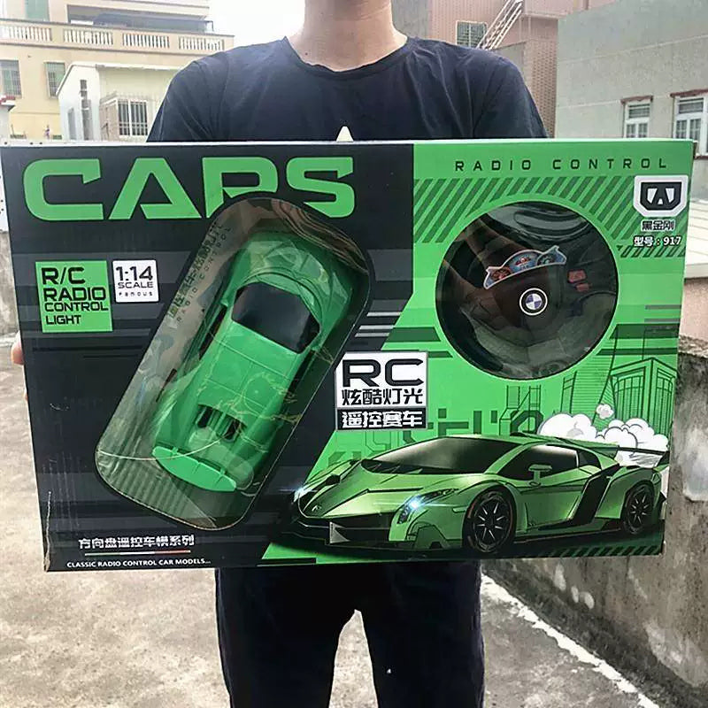 Green angular toy car and wheel-style controller in one retail kit.