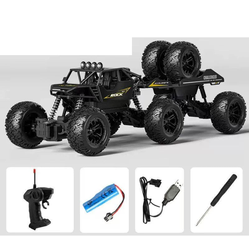 Black RC crawler and its pictured controller and charging accessories.