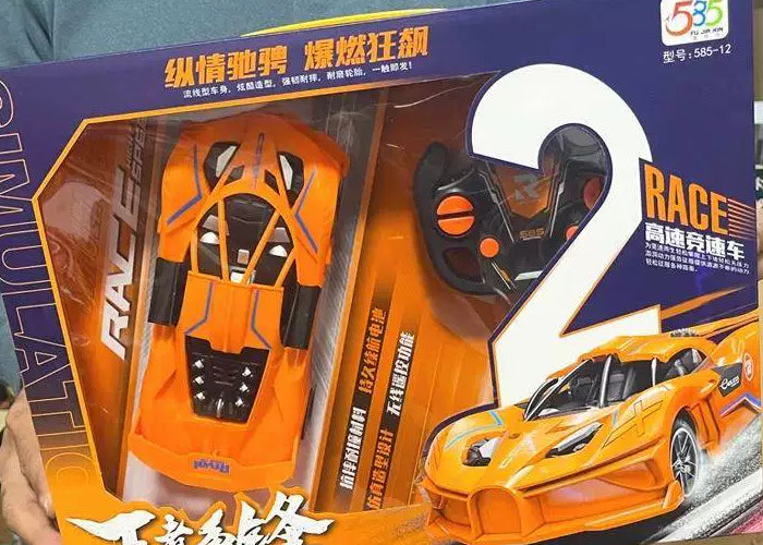 Orange sports-car body and controller through the original retail window.