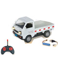 White flatbed truck with its specified controller, rechargeable battery and USB cable.