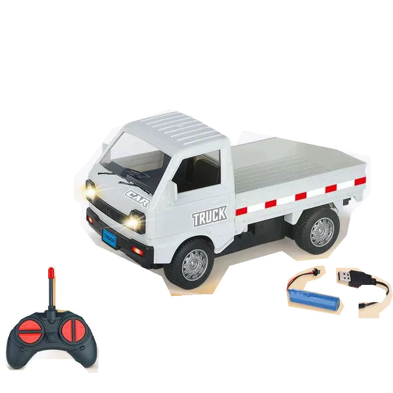 White flatbed truck with its specified controller, rechargeable battery and USB cable.
