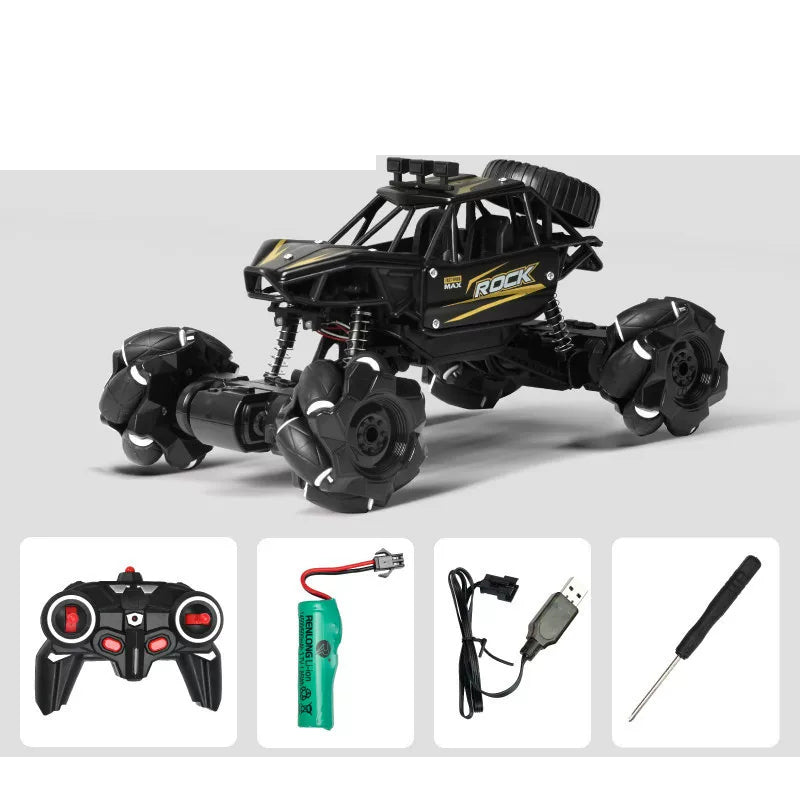 Black RC crawler and its pictured controller and charging accessories.