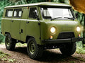 Green C104 RC van in an outdoor setting.