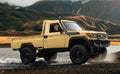 Yellow MN82 RC pickup with snorkel and open cargo bed