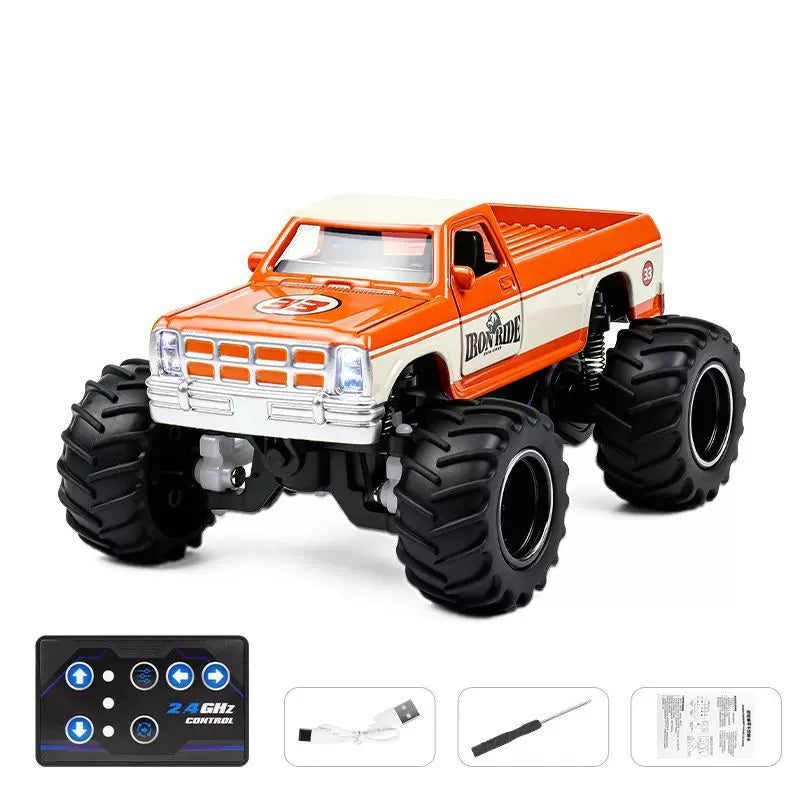 1:64 Classic Mini RC Monster Pickup: Orange Cream 33 IRON RIDE selected vehicle with blue-button card remote, charging cable, screwdriver and manual