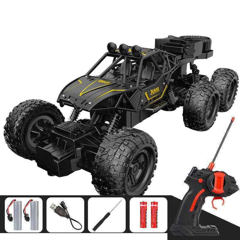 Black RC crawler and its pictured controller and charging accessories.