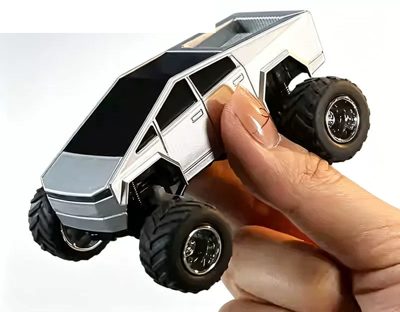 Silver angular RC truck held in a hand