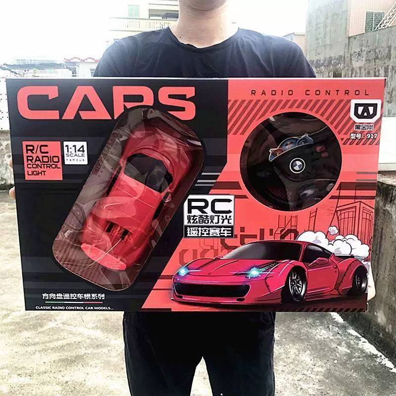 Red rounded coupe and wheel-style controller in its exact retail kit.
