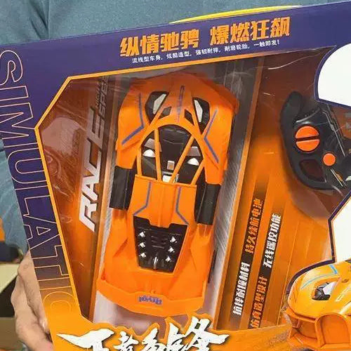 Orange car body through its retail window.