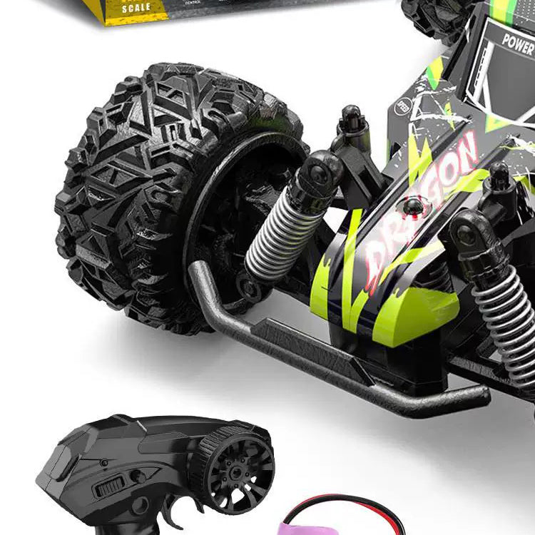 Green Graphic RC Racing Buggy: detail of the pointed racing shell, body graphics and suspension