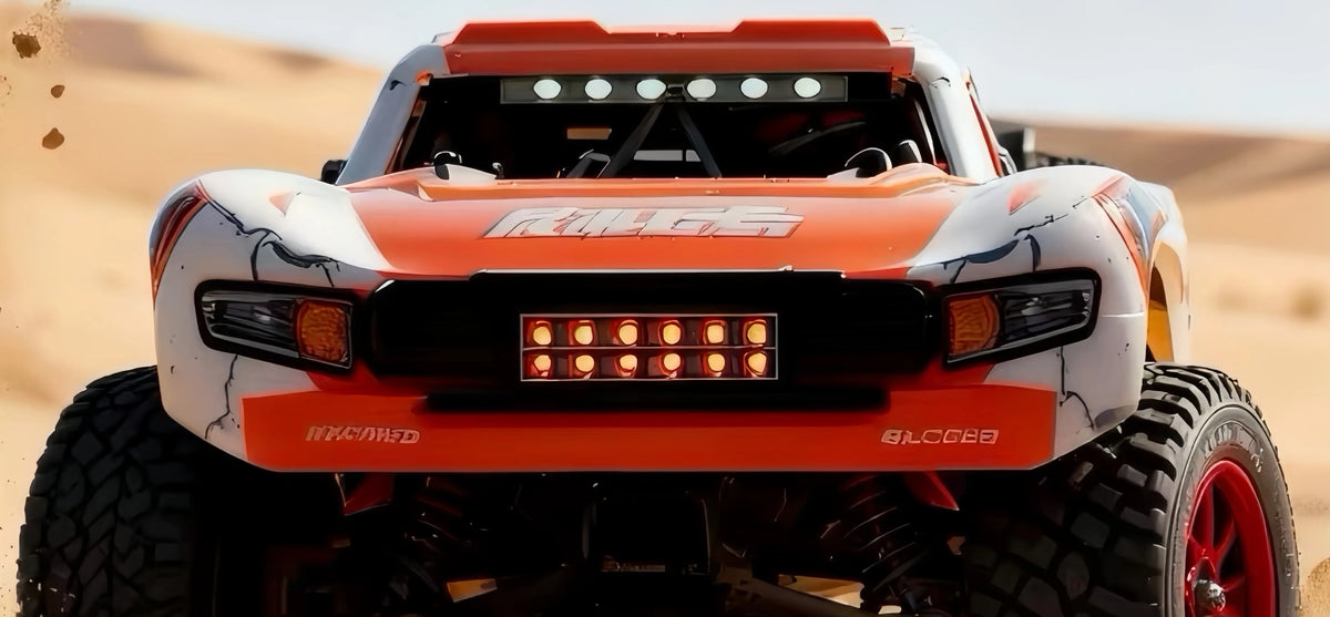 Front body, grille, wheel and chassis detail of the orange RAPID Q130B