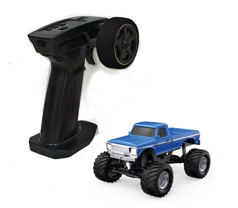 Blue RC pickup beside its handheld remote controller