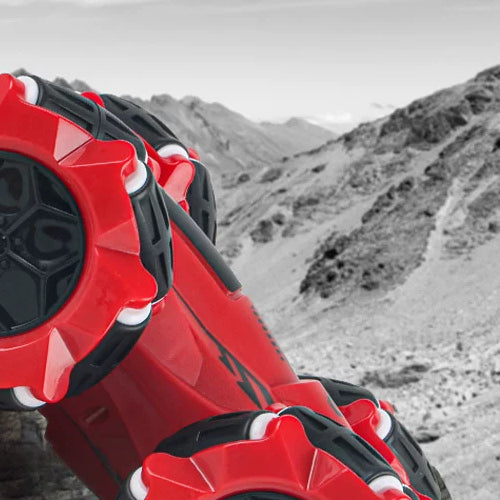 Side close-up of the red RC stunt car wheel assembly