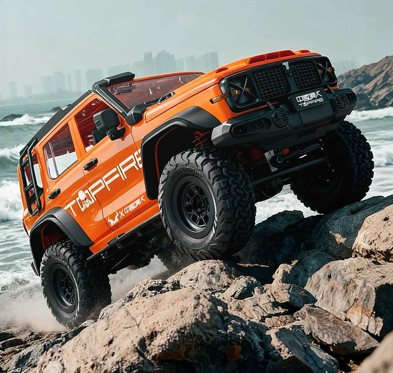 Orange MN300 RC crawler shown on rocky terrain