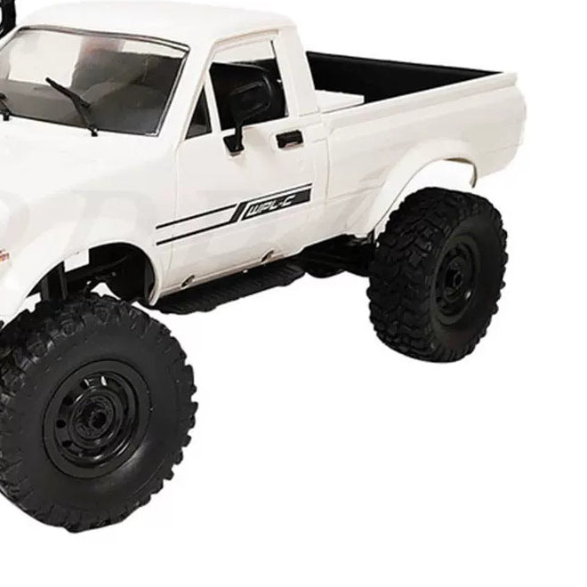 White pickup open cargo bed,cab and rear wheel detail