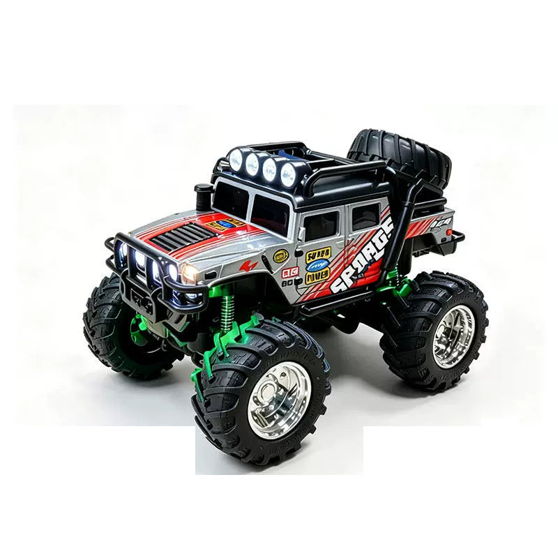 Gray mini RAGE RC truck showing its body graphics and treaded tires