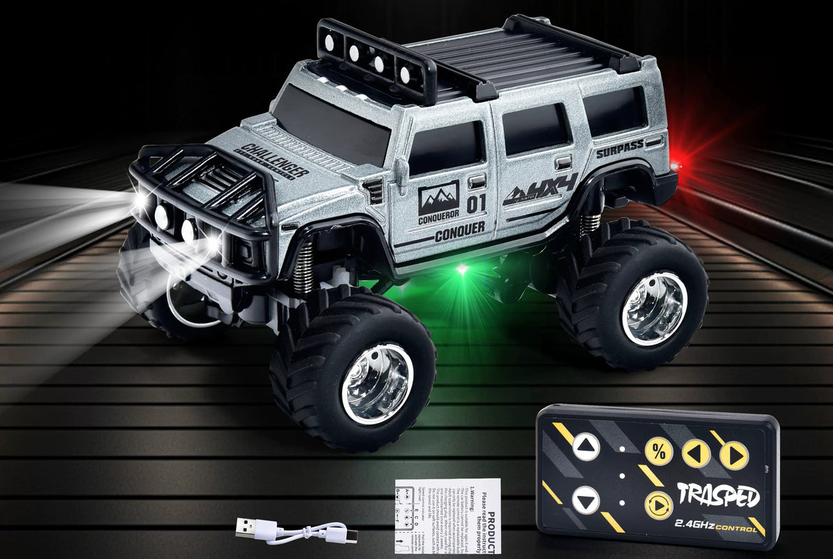 Silver Hummer-style mini RC SUV beside a card-style remote and USB cable