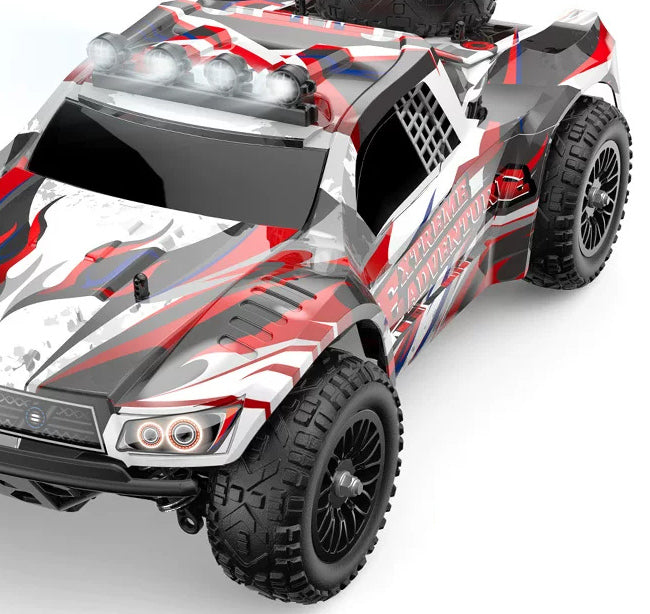 Red EXTREME ADVENTURE RC truck, body and front-wheel detail crop