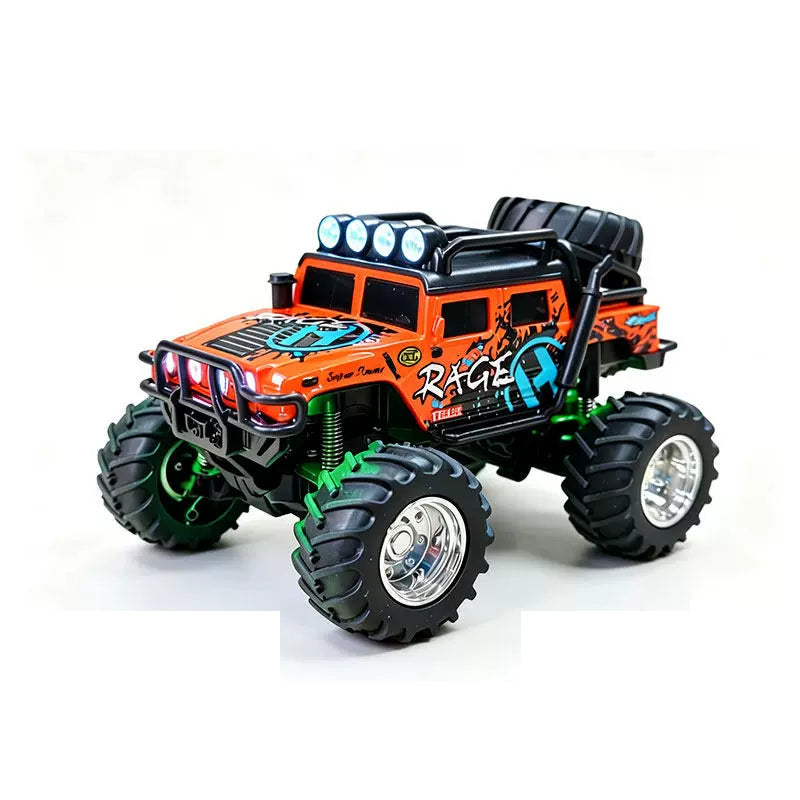 Orange mini RAGE RC truck showing its body graphics and treaded tires