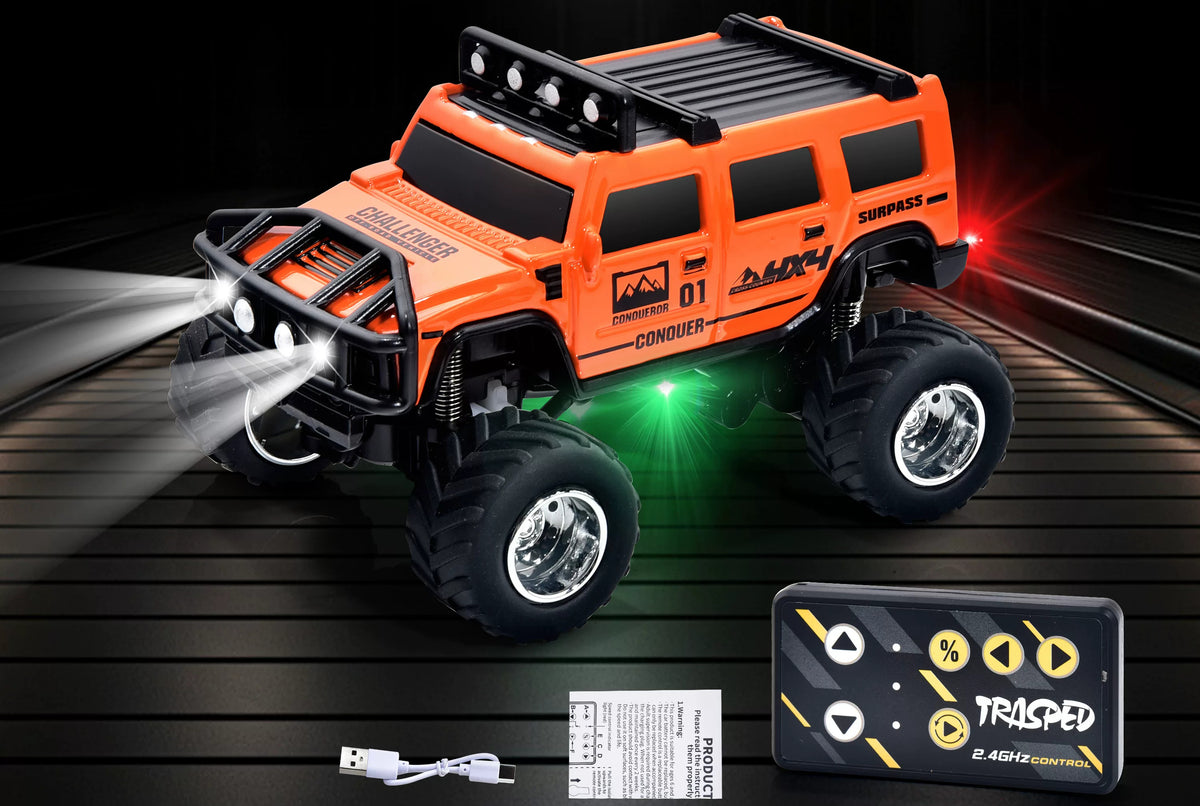 Orange Hummer-style mini RC SUV beside a card-style remote and USB cable