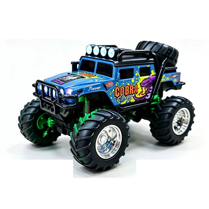 Gray Blue mini RAGE RC truck showing its body graphics and treaded tires