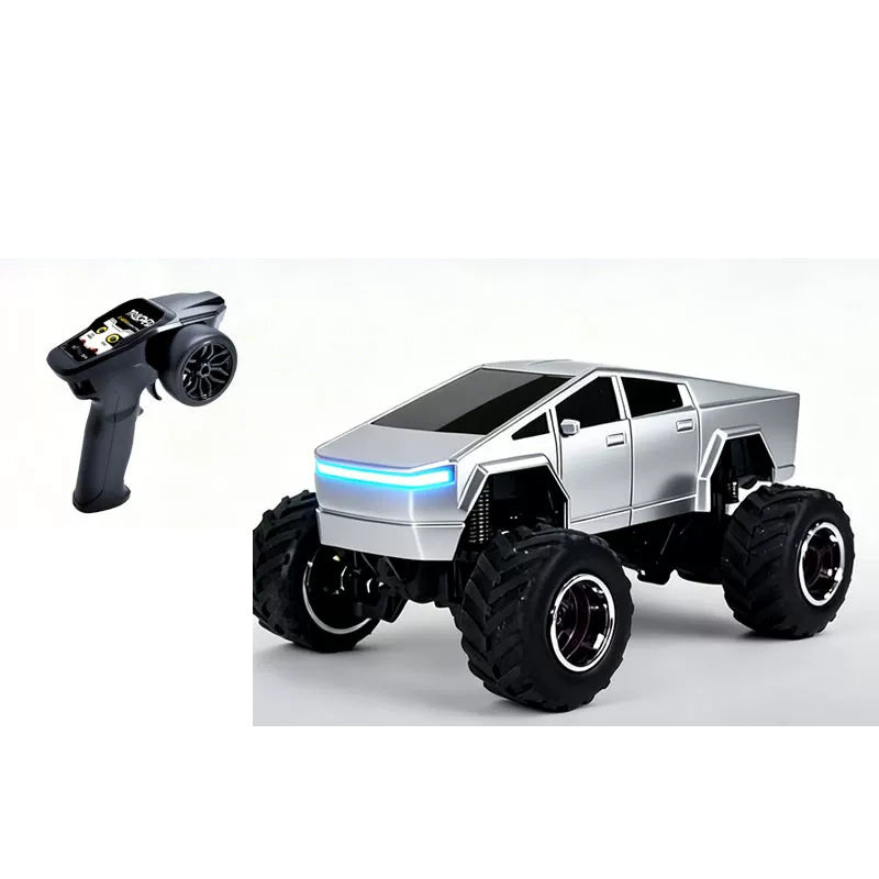 Silver angular RC truck beside its pistol-style remote controller